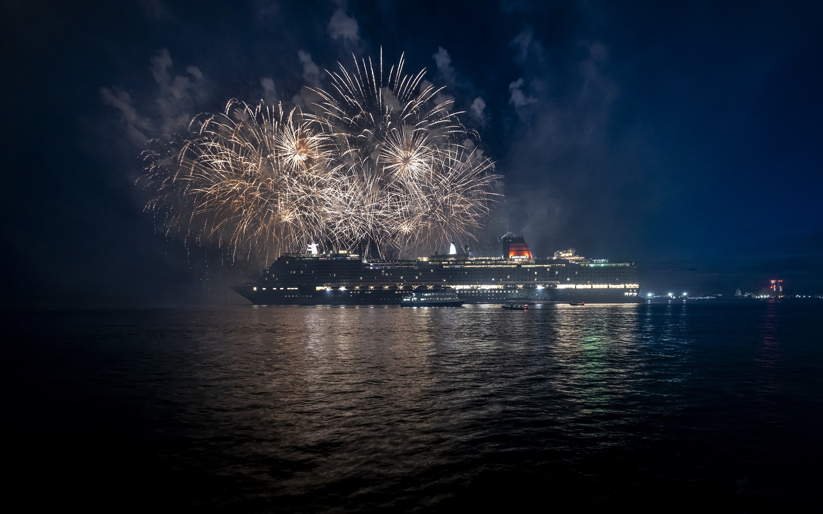 Cunard's Queen Anne ship with fireworks in the background