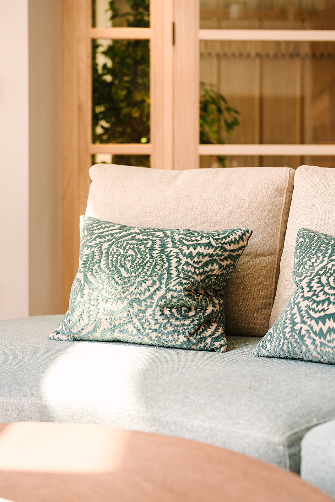 table, chair and cushion detail in The Reeds