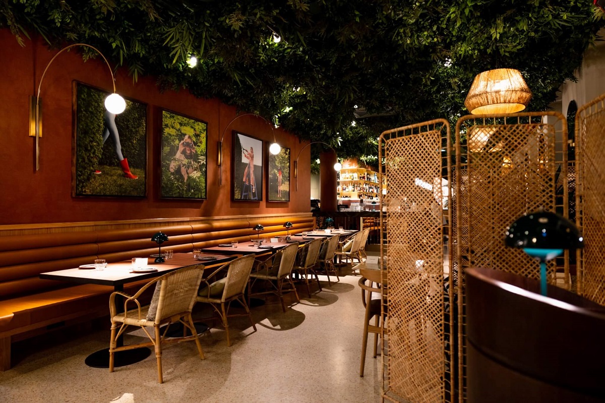 restaurant with terracotta walls and green accents in Verno House