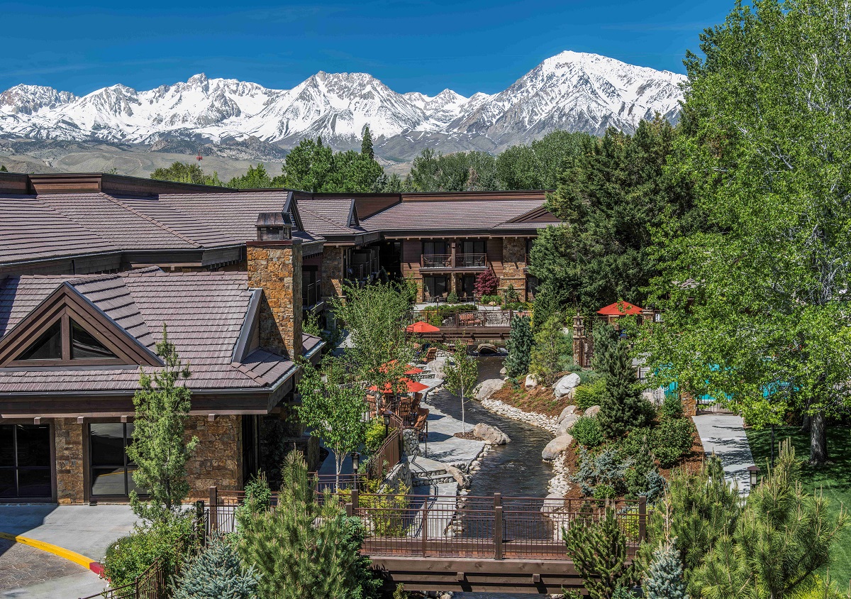 exterior of Wayfinder Bishop with snow topped mountains in the background