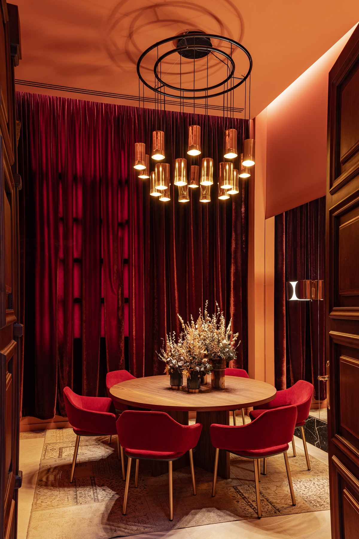 red and gold decor in private dining room in Mache Melia collection