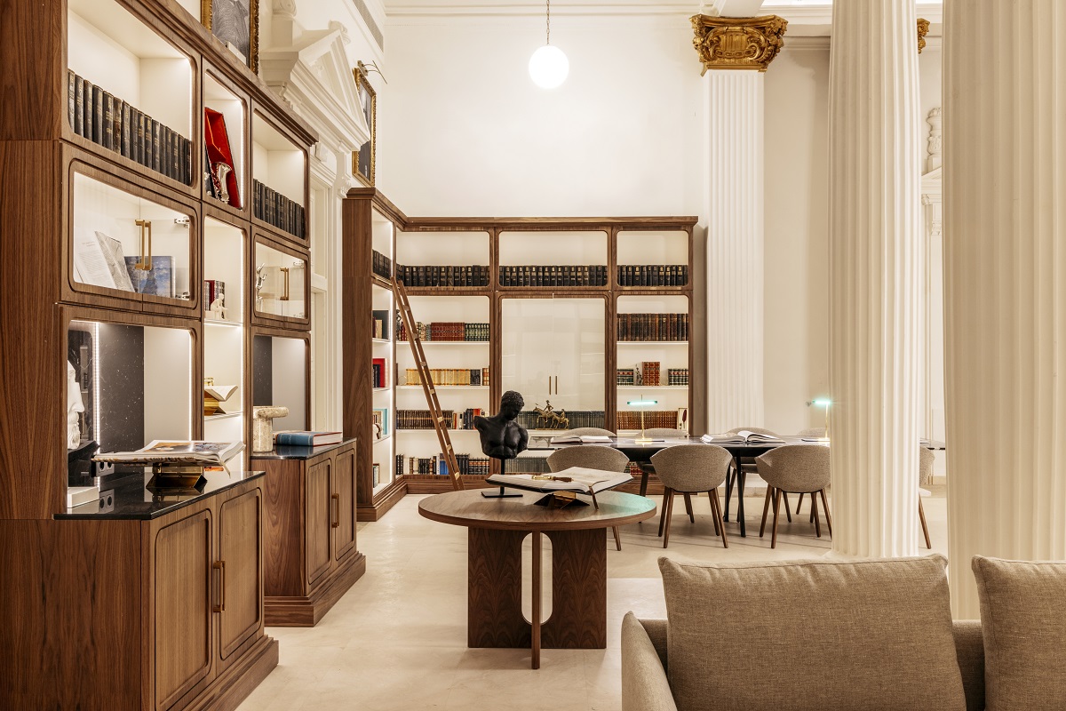 seating and bookshelves in library room of Casa de las Artes Madrid