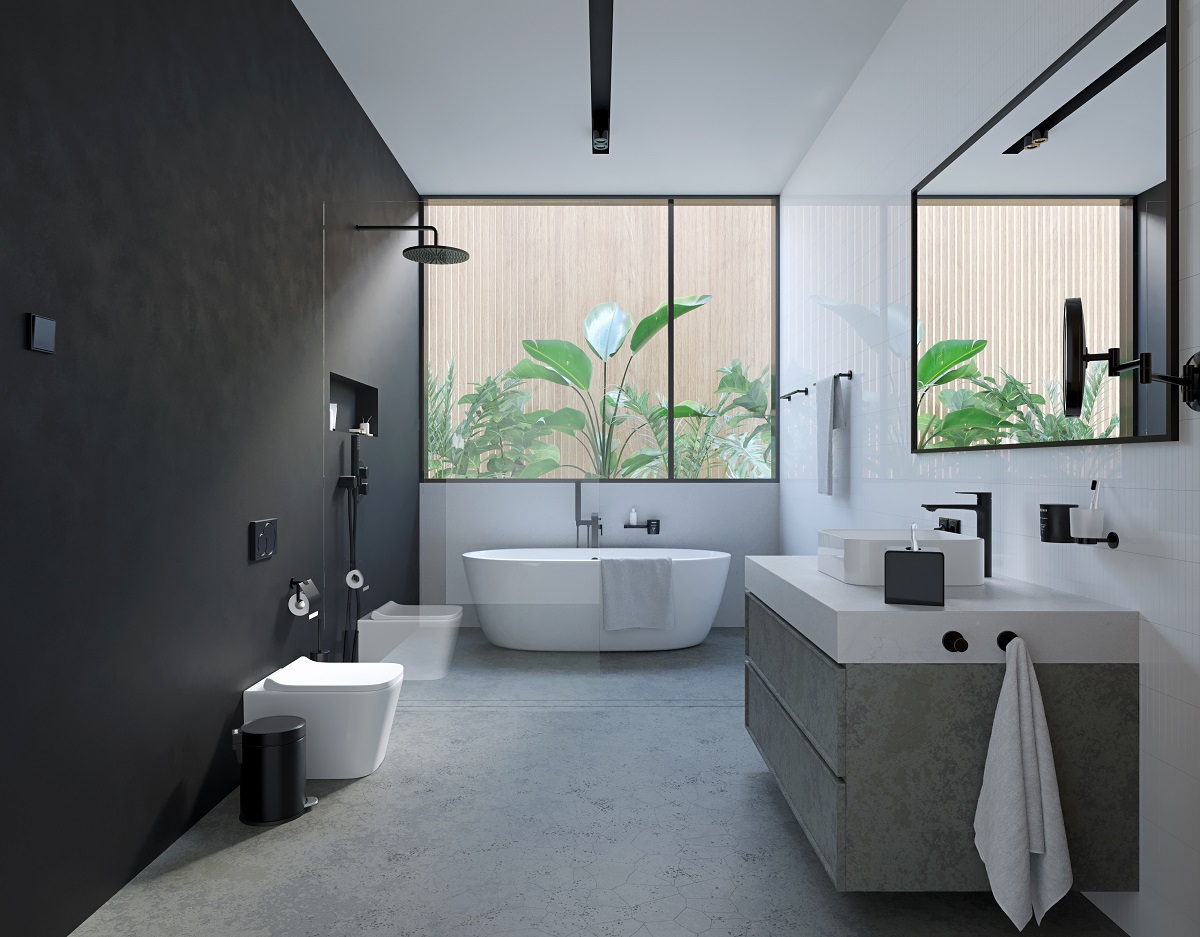 grey and white bathroom with freestanding bath in front of window