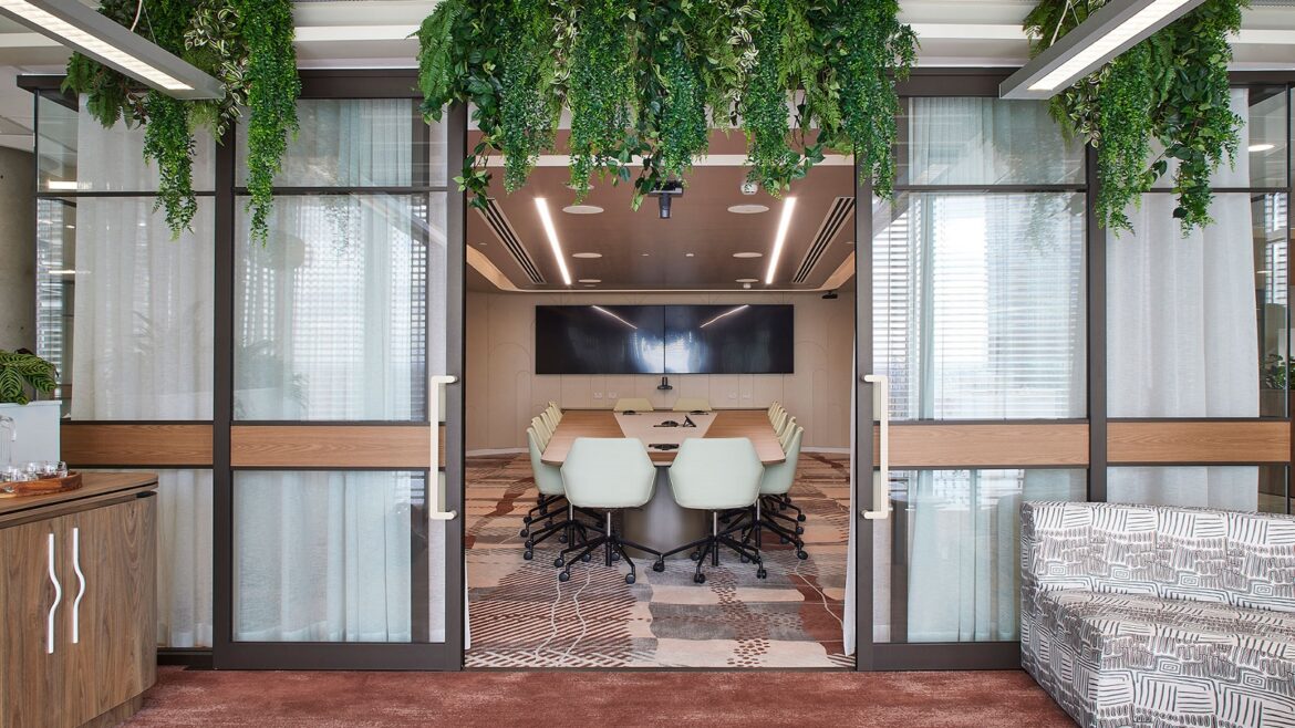 entrance to Accor head office meeting space with hanging plants and bespoke carpet from Modieus