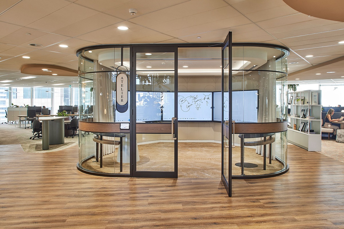 central glass meeting cubicle in open floor office