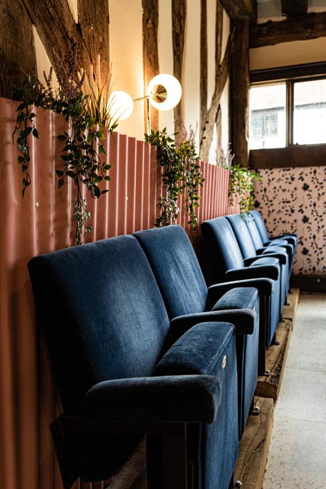 blue velvet cinema seating in bar design by Black Ivy