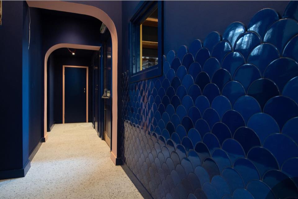 blue tiled hallway