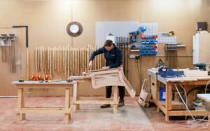 George Smith workshop with wooden chair frame being made