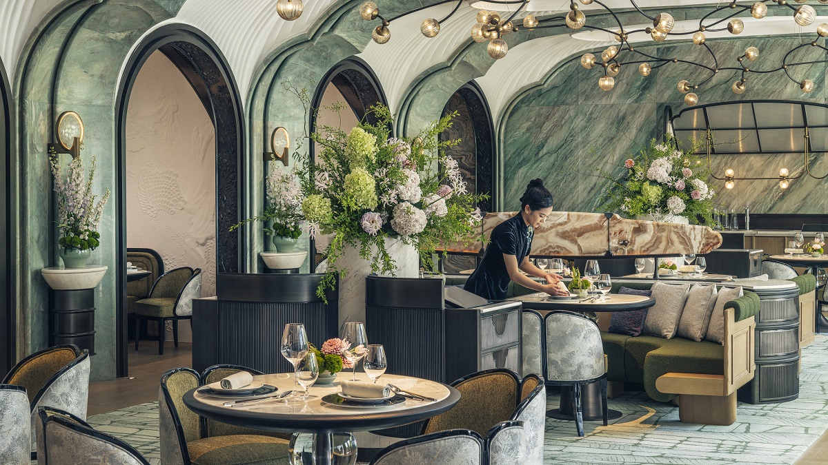 One of the hotel's restaurants, Song, is a light and airy space with pale marble floors, green veined walls, with beautiful flower arrangements and decorative floral lighting throughout