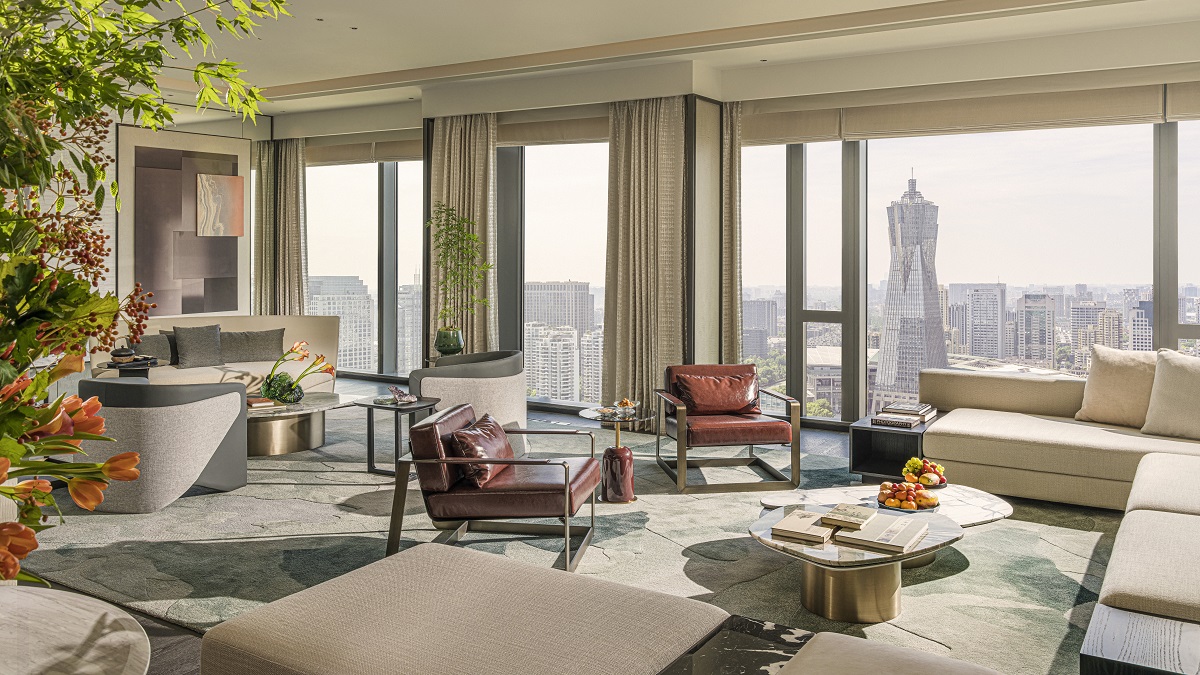 The penthouse suite has far-reaching views across the city and is decorated in calming neutral colours