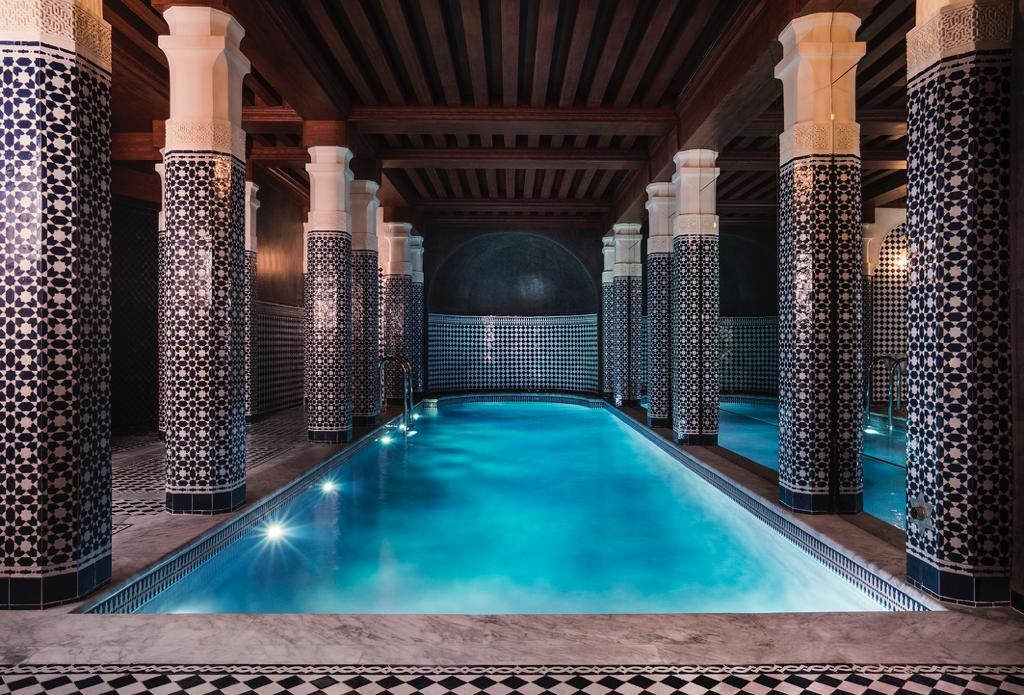 indoor pool with moroccan style tiles and pillars