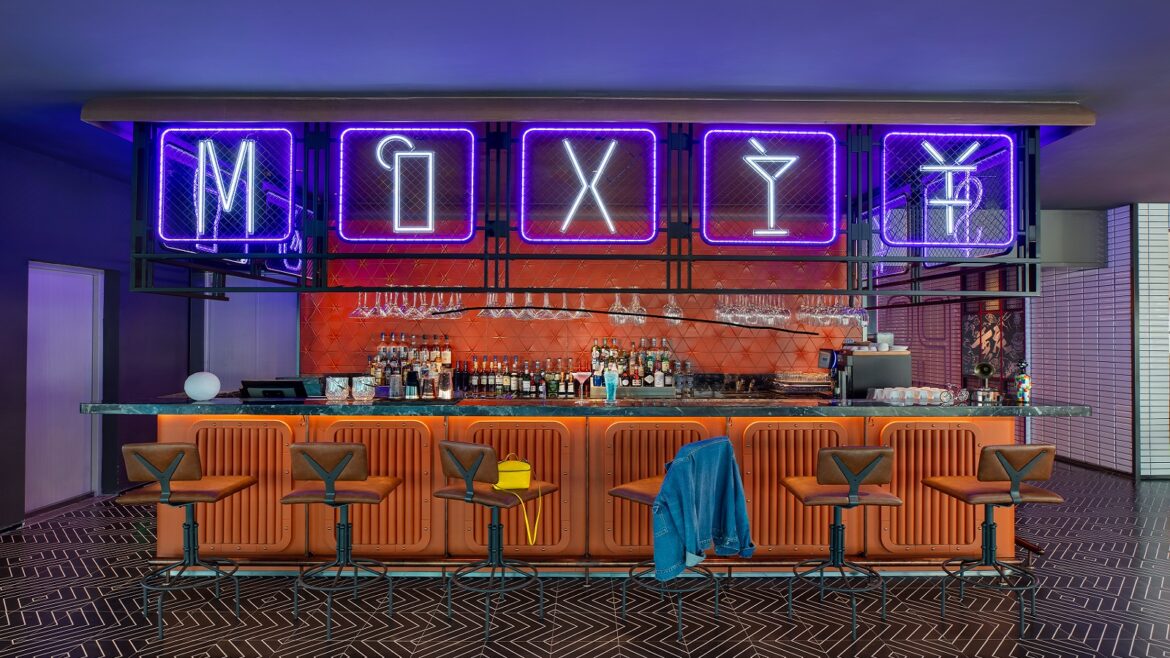 Moxy Bar in Chongqing with neon writing and orange tiled surfaces