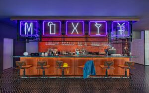 Moxy Bar in Chongqing with neon writing and orange tiled surfaces