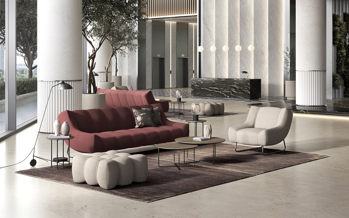 plum coloured couch and cream chairs from BoConcept