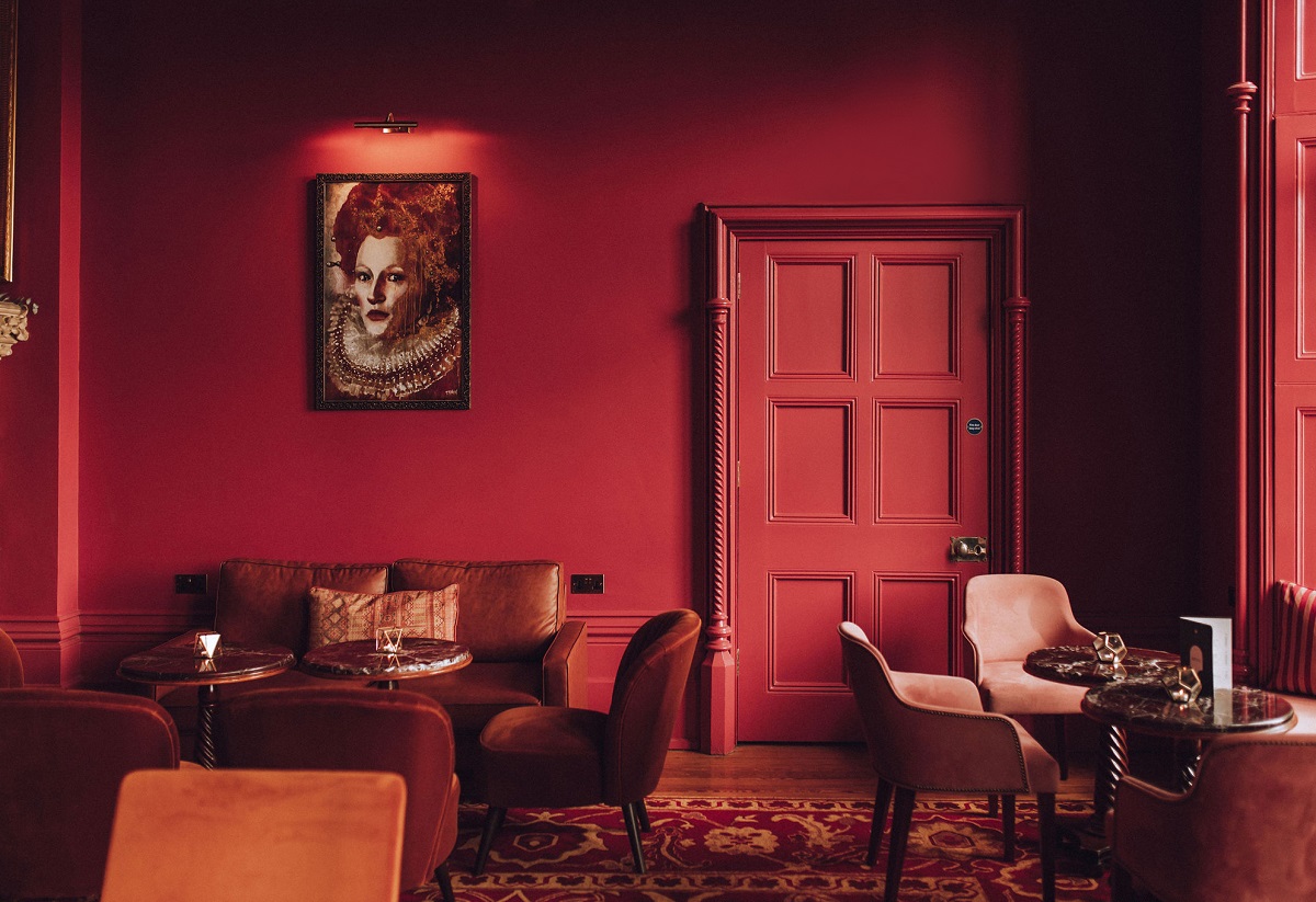 red on red interior at elevtham hotel with bespoke Ege carpets on the floor