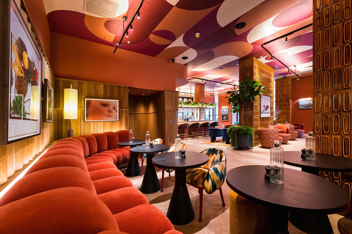 curved banquette, painted patterned ceiling and textured tiles in wilde Liverpool street