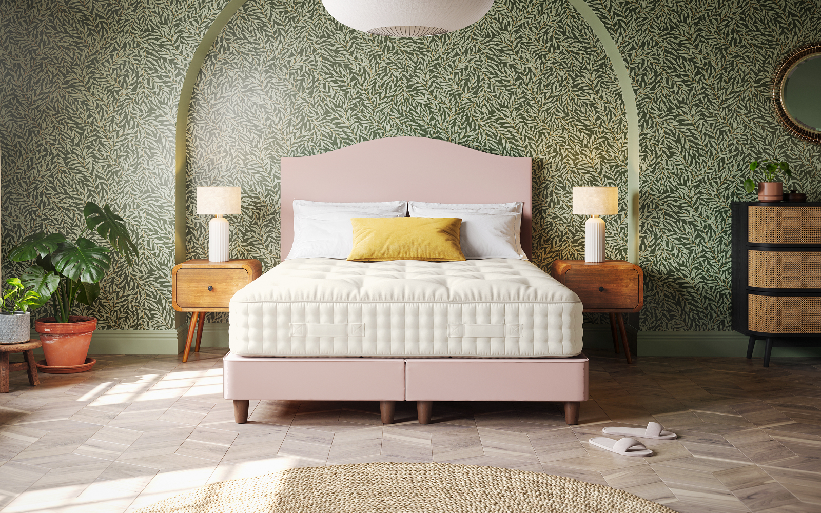 green wallpaper with bed and pink headboard in arched alcove