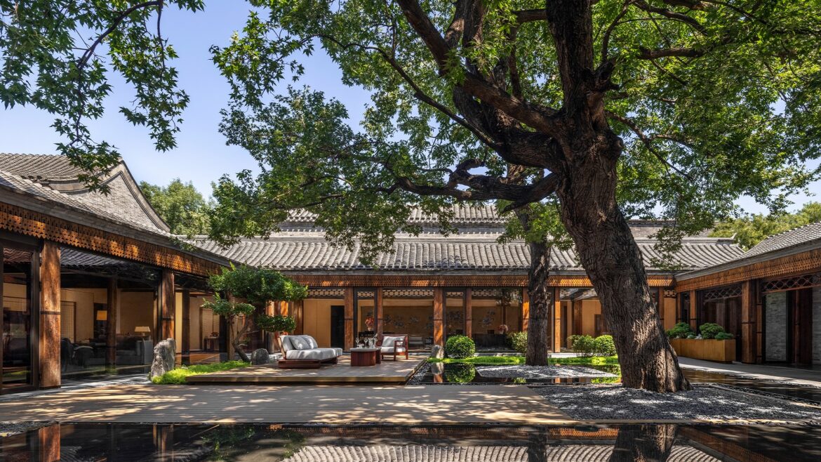 central courtyard at Mandarin Oriental Qianmen with tree and wooden deck