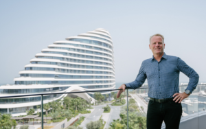 architect shaun Killa standing in front of Jumeirah Marsa Al Arab in Dubai