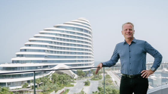 architect shaun Killa standing in front of Jumeirah Marsa Al Arab in Dubai