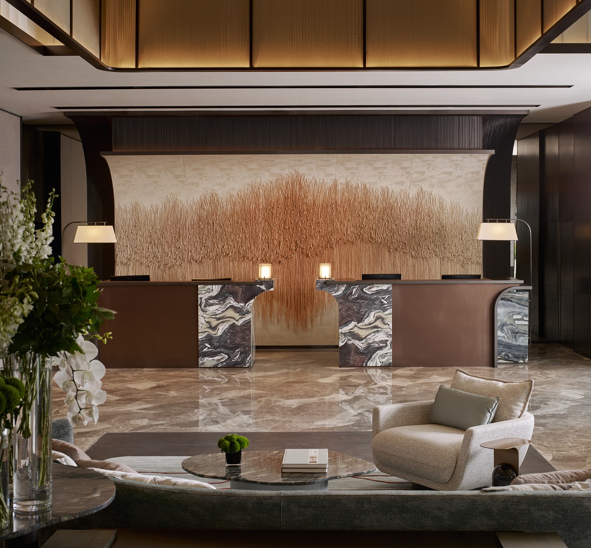 marble and textured wall feature in hotel lobby Four Seasons Hangzhou