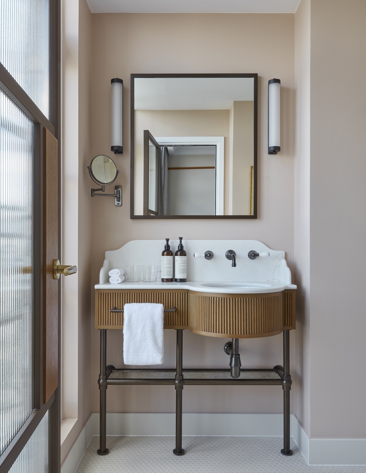 art deco inspired bathroom mirror and vanity in bathroom at Le Grand Hôtel Cayré