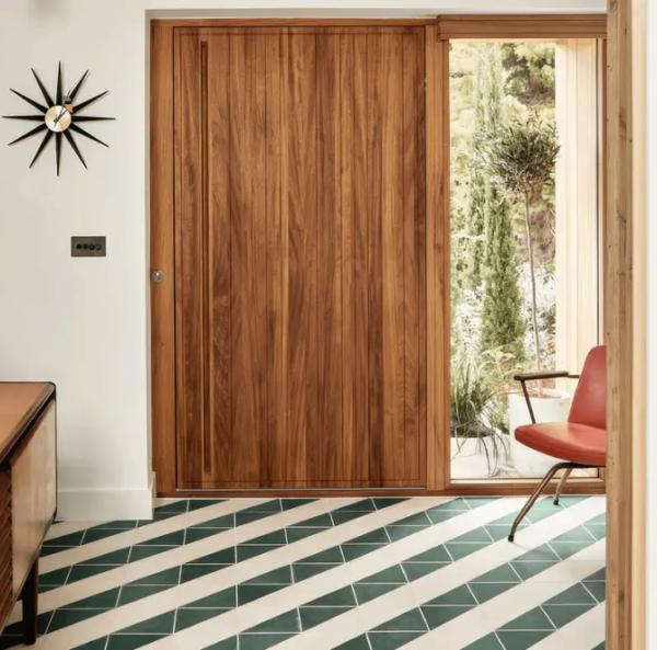 Hyperion Tiles green and white striped floor design using the brand's Livid Alalpardo Encaustic Tile