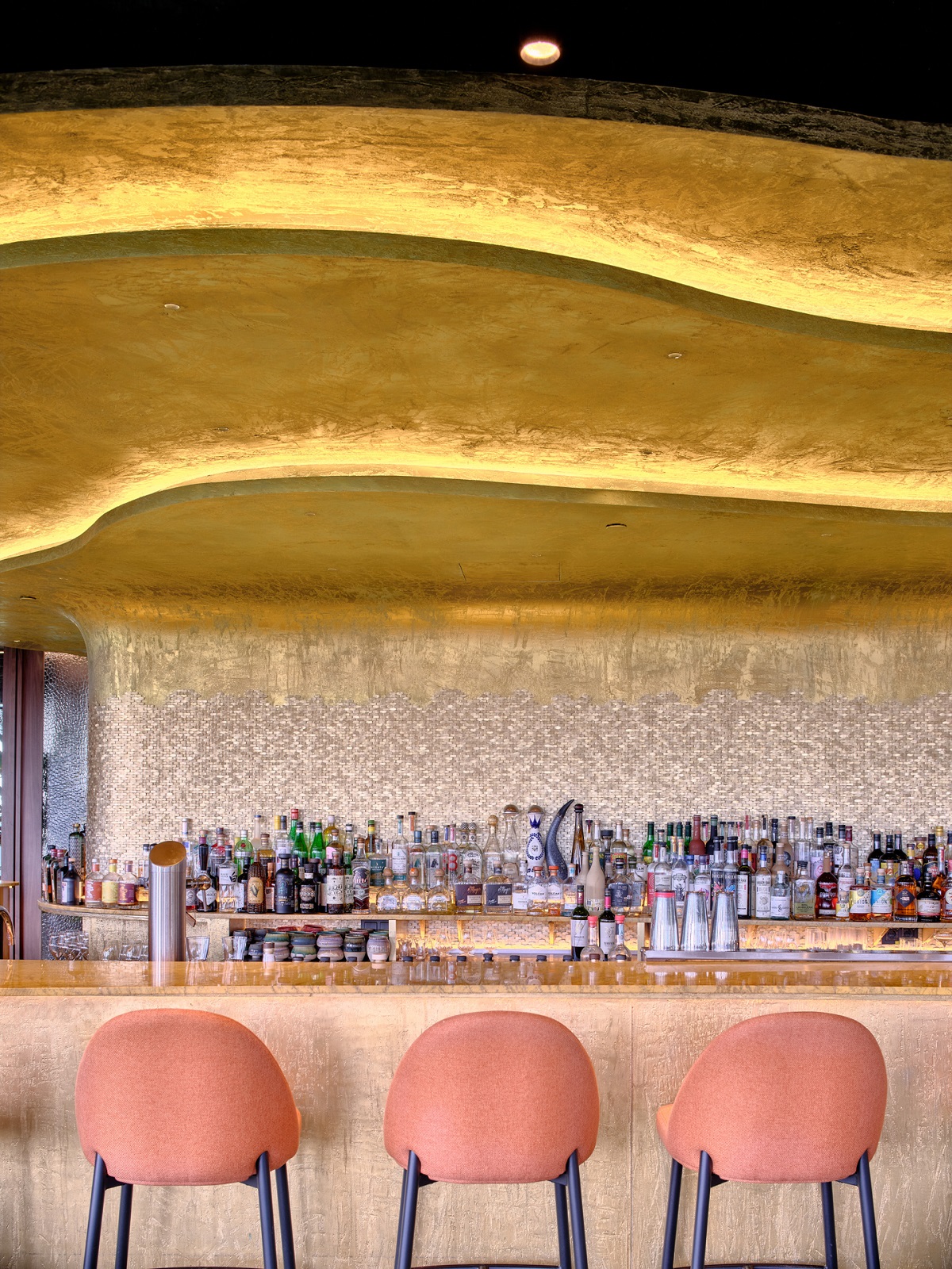 curved gold ceiling detail above the bar in sonora