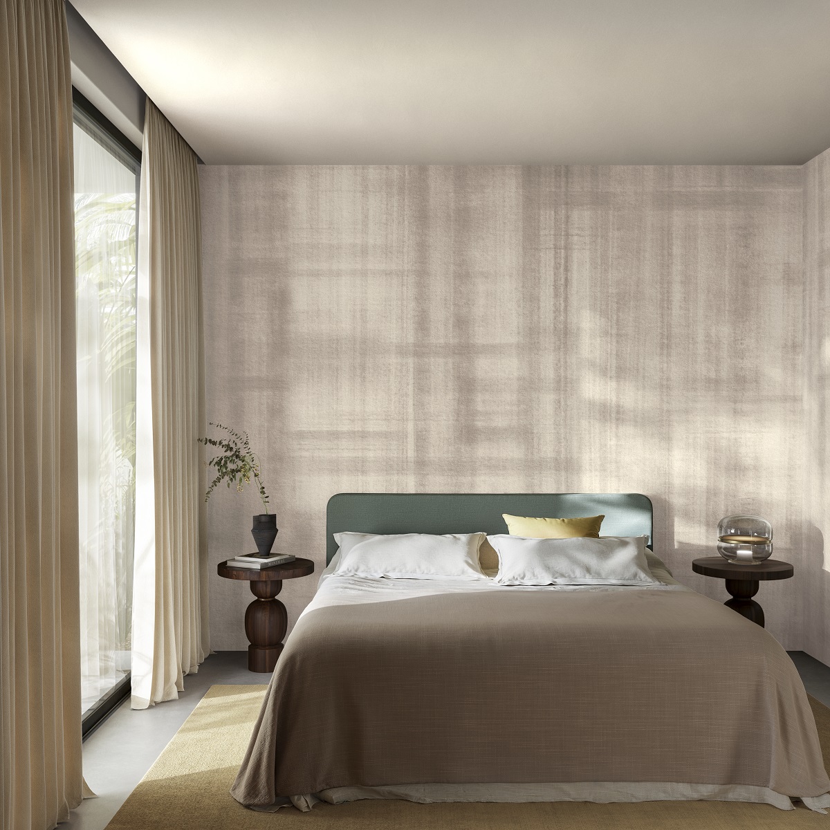 bed with stone coloured throw set against textured Arte Doudeville wallcovering