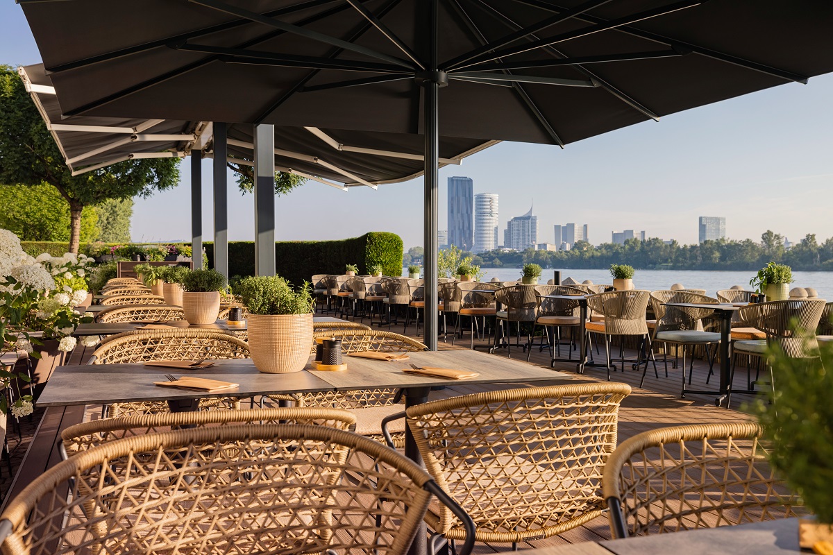 wicker chairs on hotel terrace overlooking the Danube