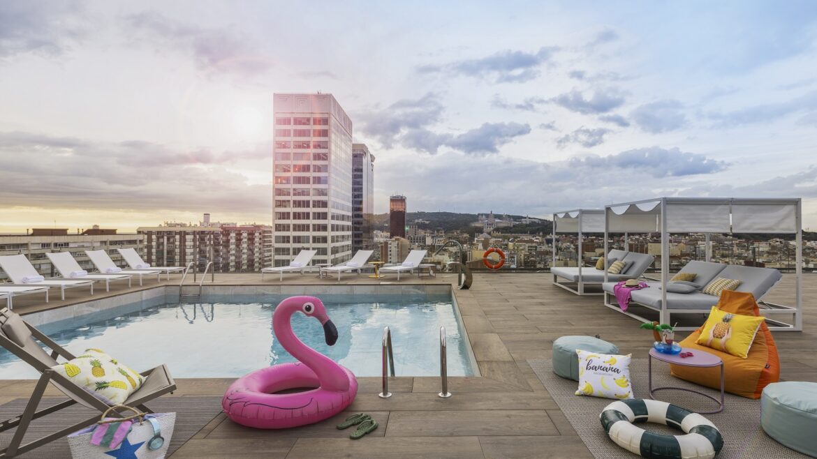 pink inflatable flamingo at pool around Moxy Barcelona