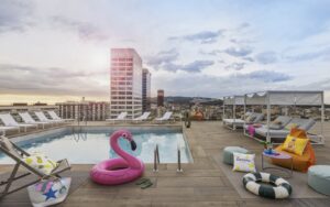 pink inflatable flamingo at pool around Moxy Barcelona