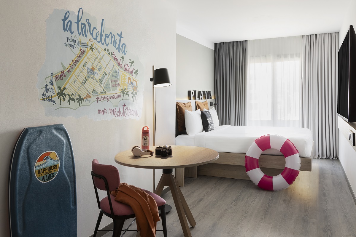 guestroom with painted mural of map of barcelona