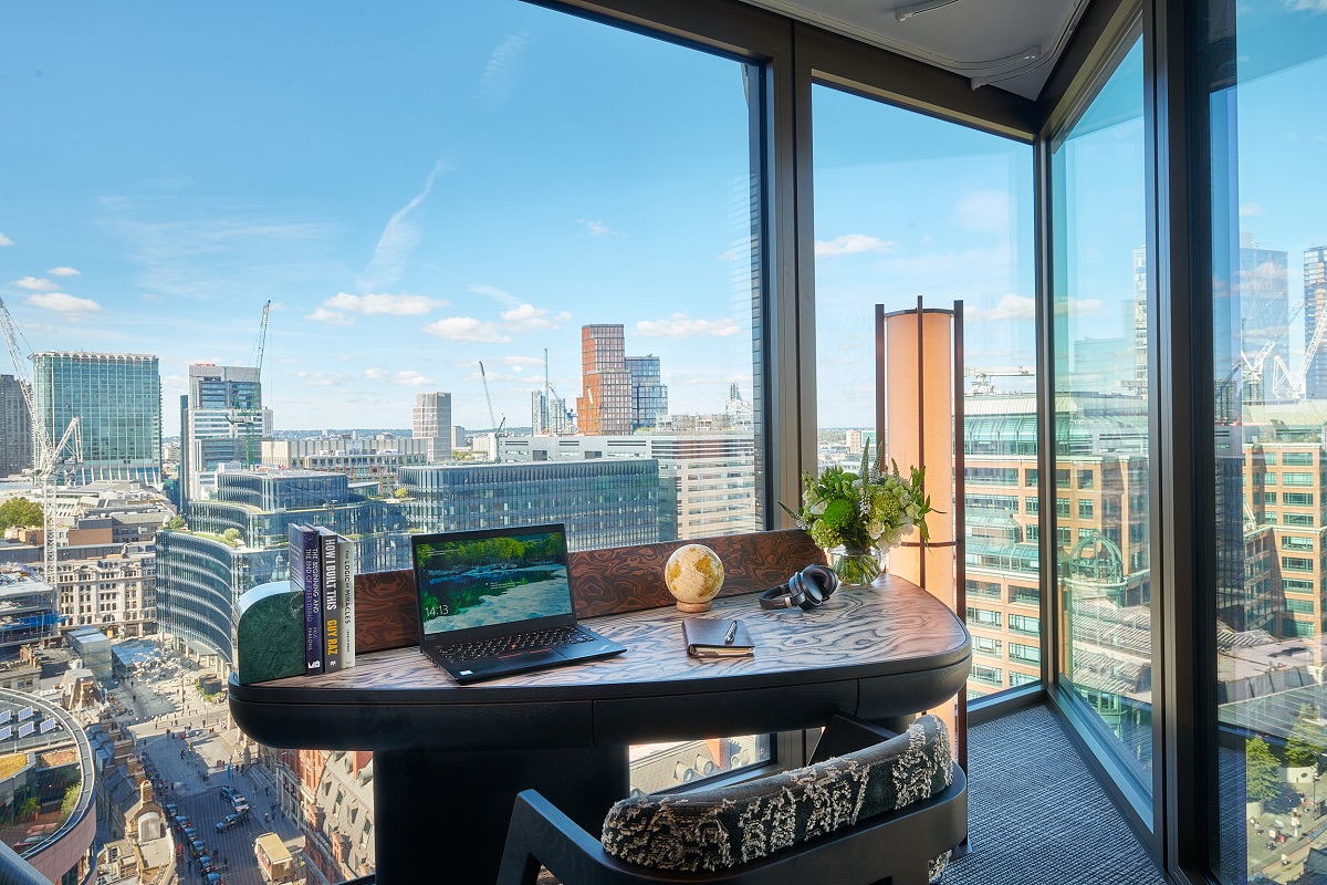 floor to ceiling windows behind ergonomic bespoke desk in suite at Pan Pacific London