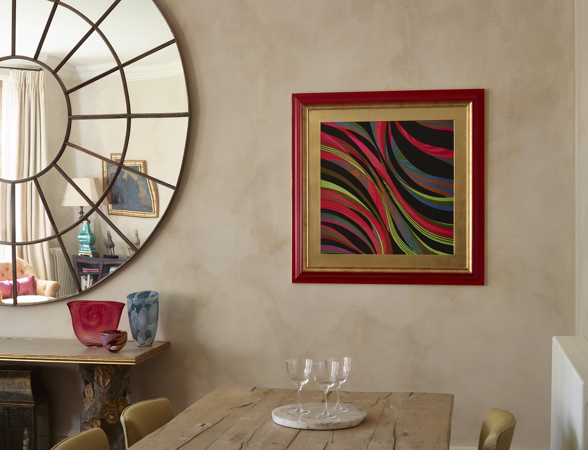 colourful framed scarf from richard allan collection on wall