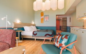 turquoise and brown mid century inspired aparthotel guestroom SeaSpace