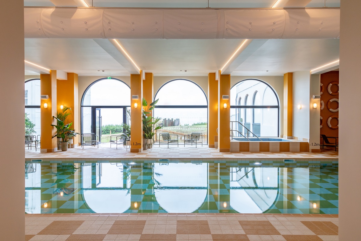 art deco arches around an indoor pool at SeaScape aparthotel