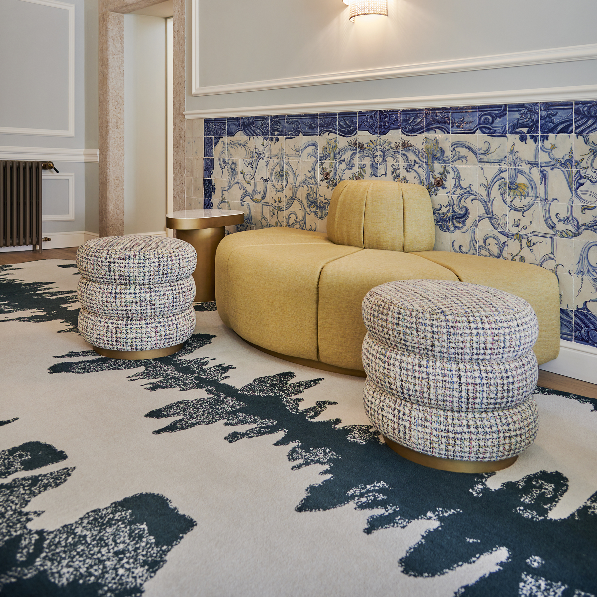 blue tiles and yellow seating on blue bespoke carpet woven by ege carpets in Palacio Ludovice