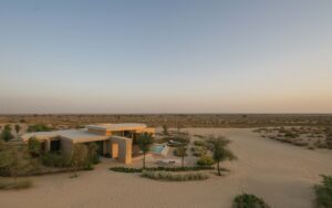 view across desert and Bab Al Shams desert villa