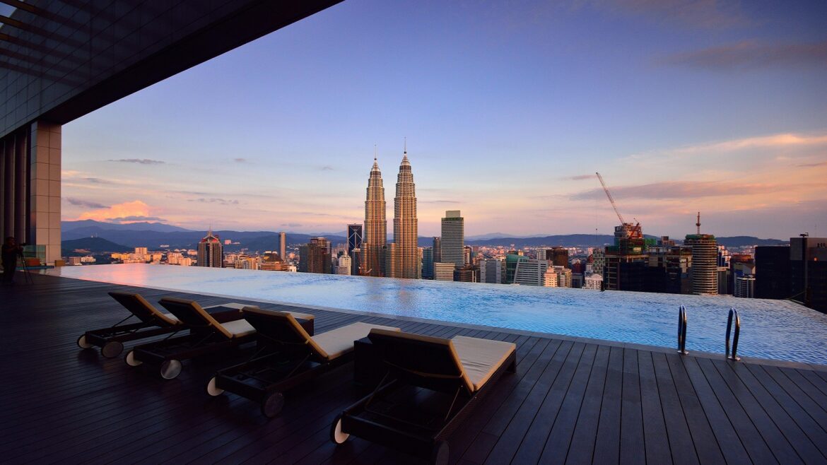 infinity pool and city skyline in ultra luxury hotel