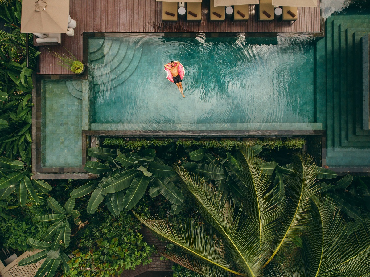 aerial view of luxurious swimming pool in tropical location