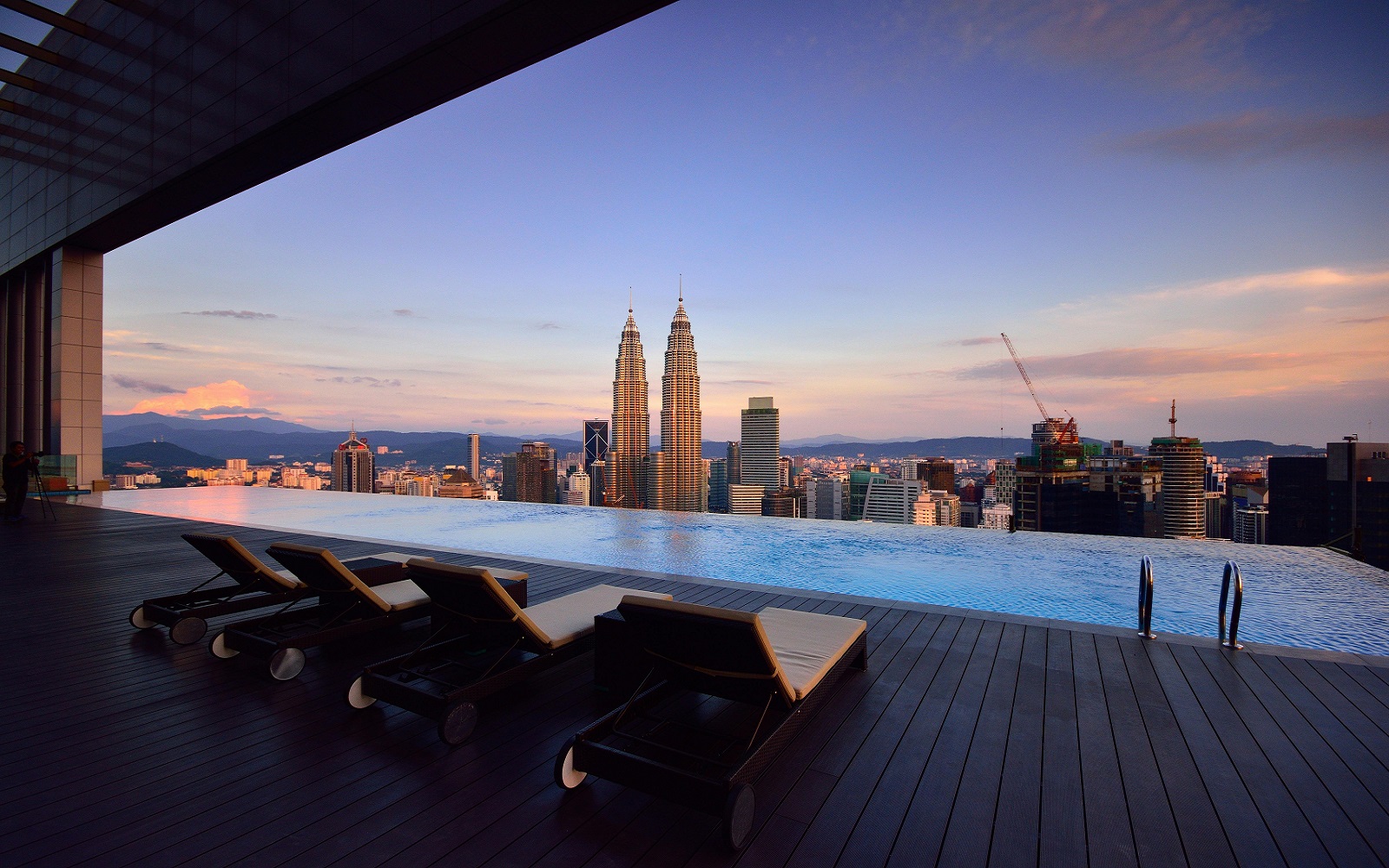 infinity pool and city skyline in ultra luxury hotel