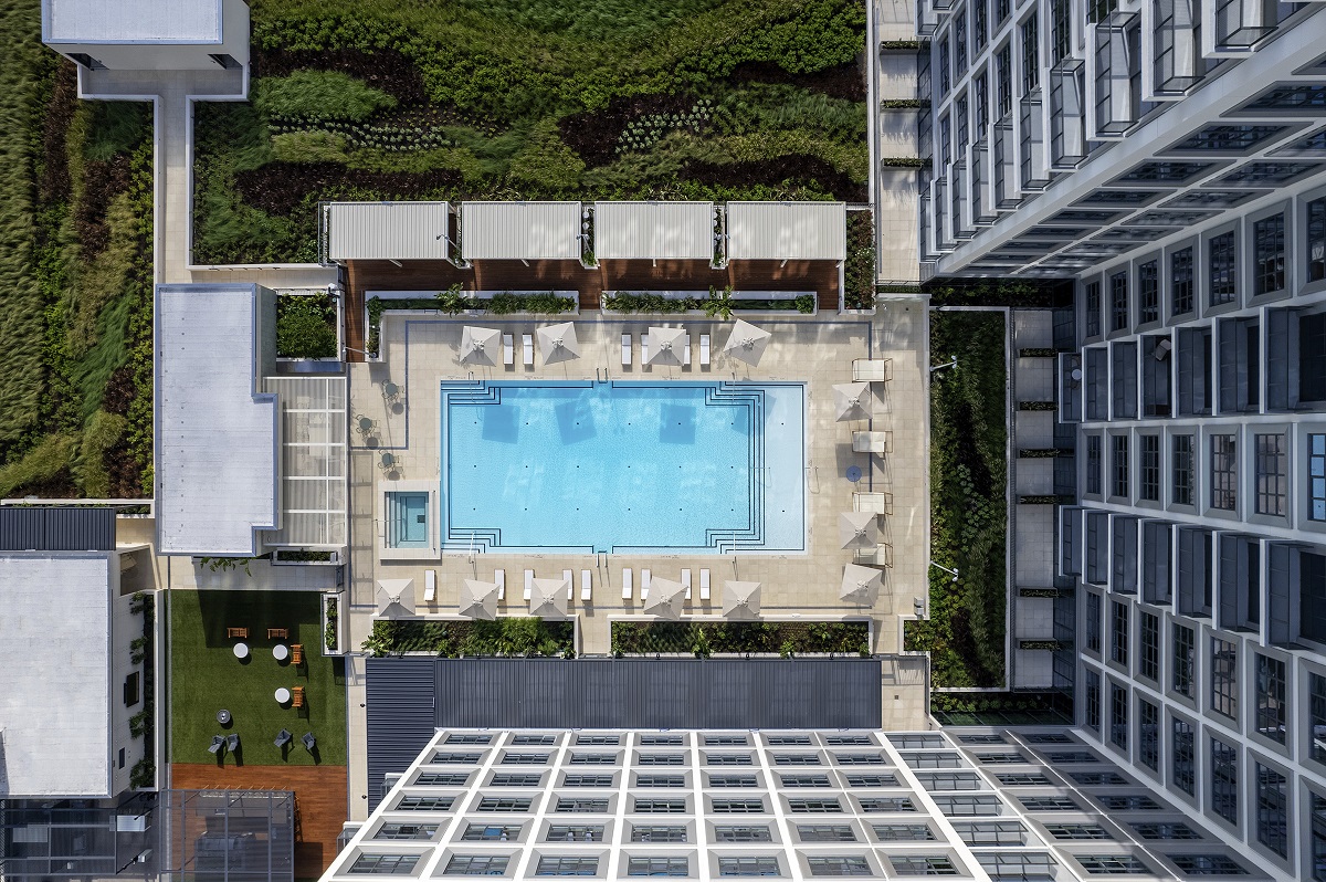 birds eye view of ROOST Tampa Asher swimming pool and facade