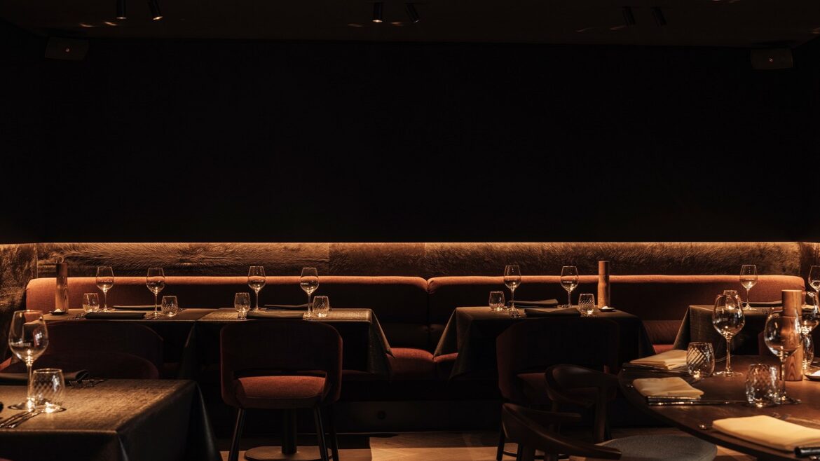 dark walls and back lit seating in Cult Bruges