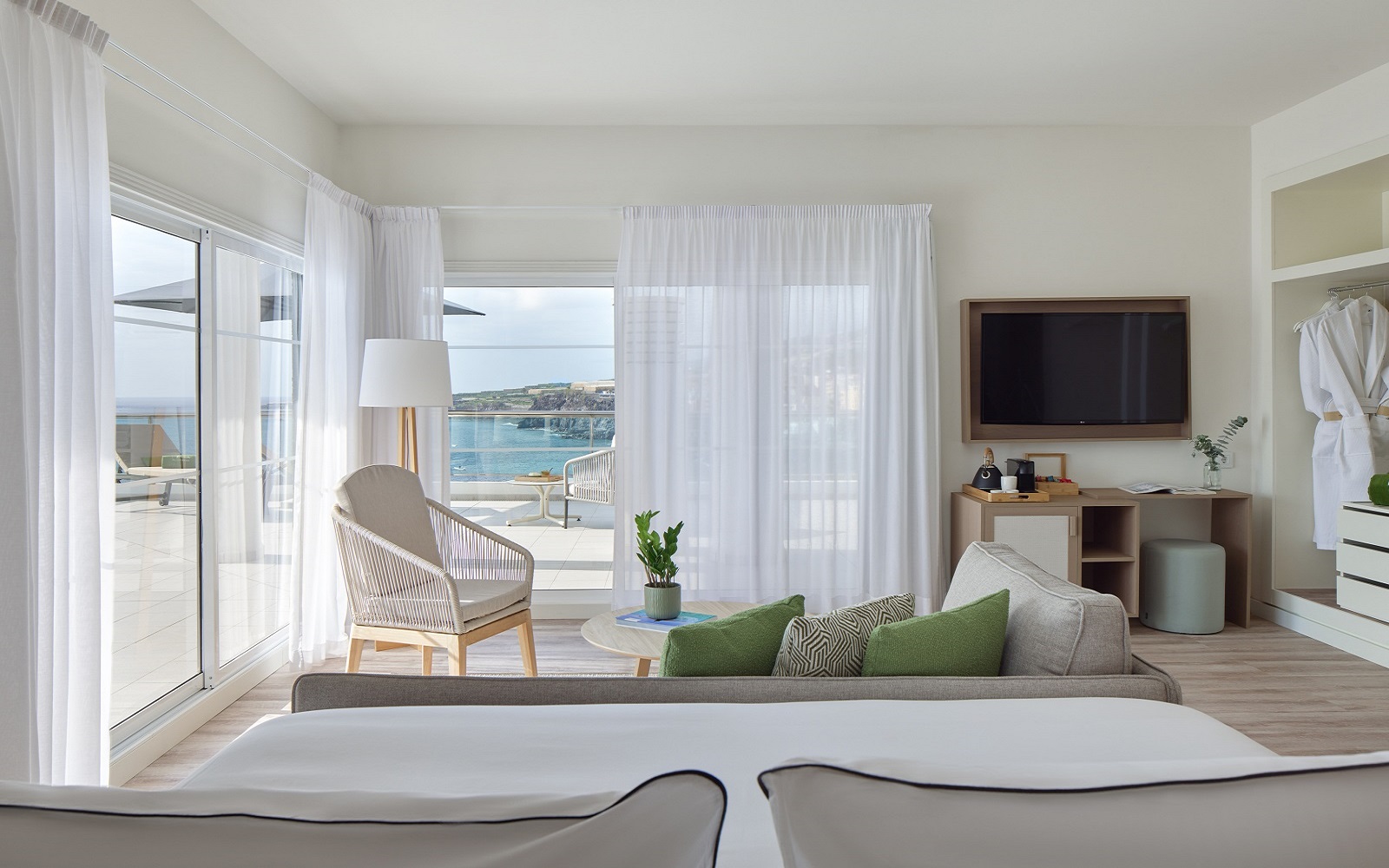 guestroom in Melia La Palma in shades of white and cream with dual aspect sea views