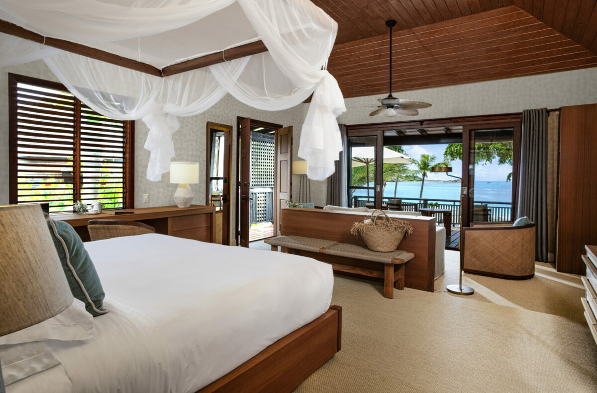 Crystal waters of Antiguan sea, viewed from beachside guestroom bedroom