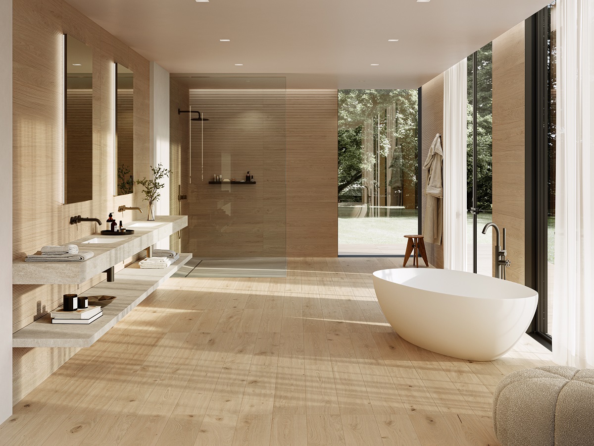 white freestanding bath in tiled bathroom