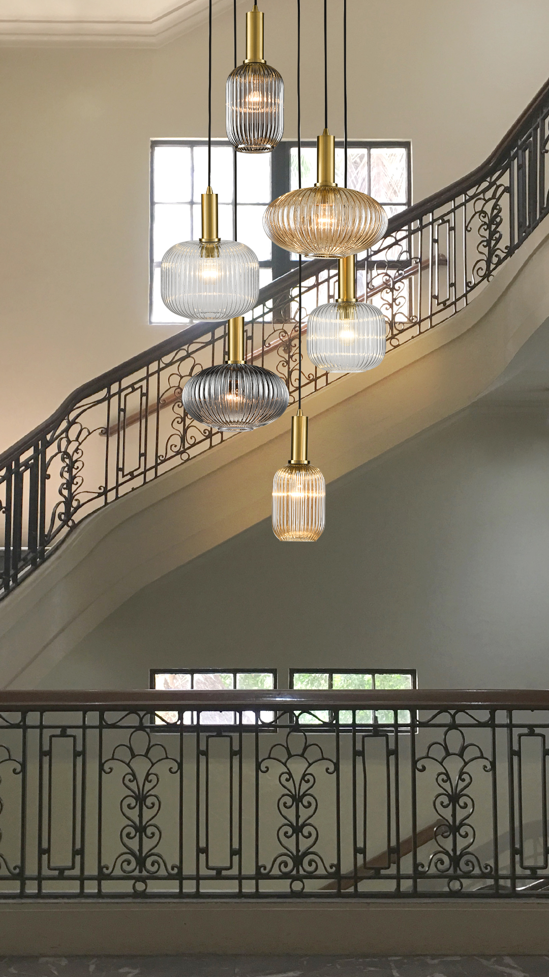 collection of glass pendant lights in stairwell