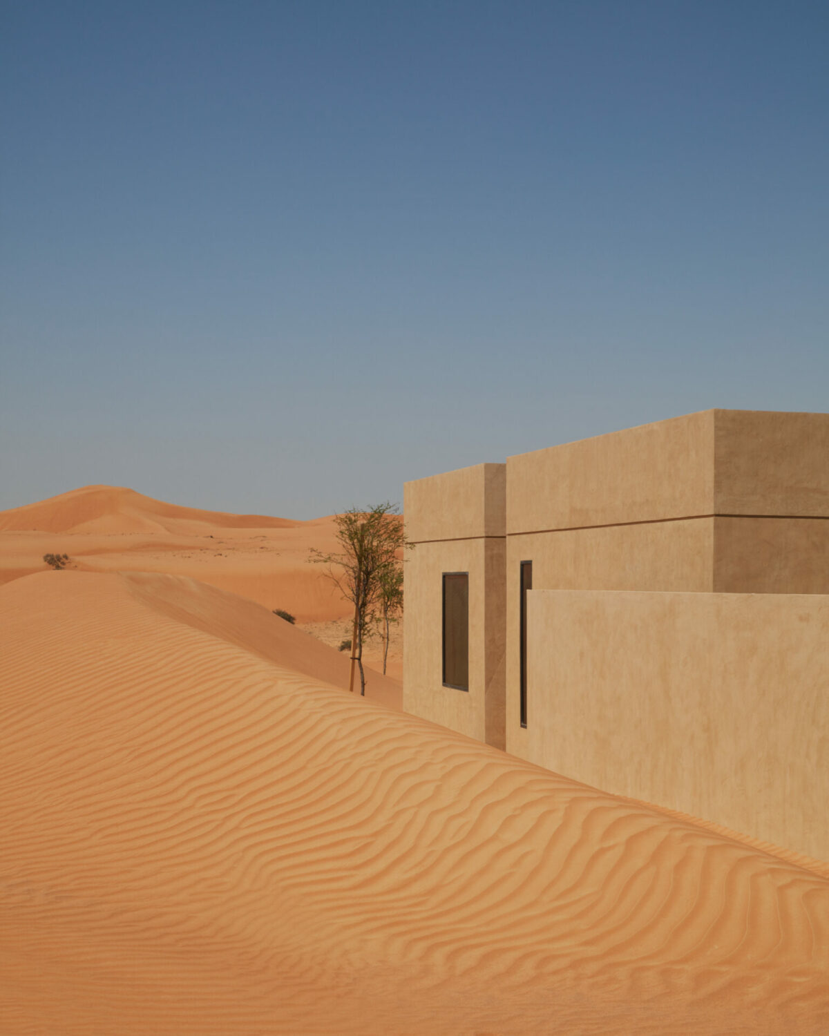 External shot of Ritz Carlton signature villa with desert in background