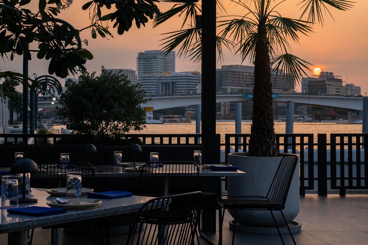 restaurant on terrace in Bangkok overlooking river